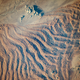 Image for article titled The abstract beauty of dunes seen from space
